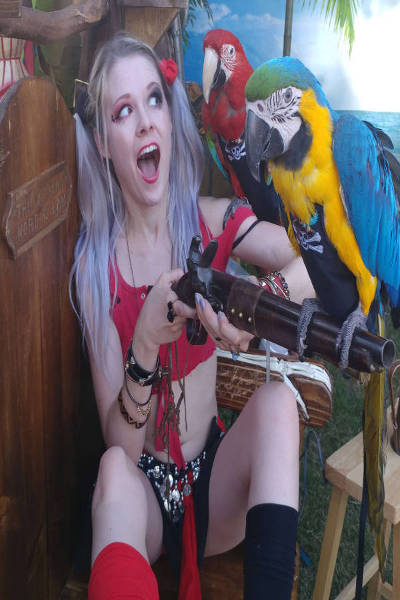 girl in bikini with gun and birds